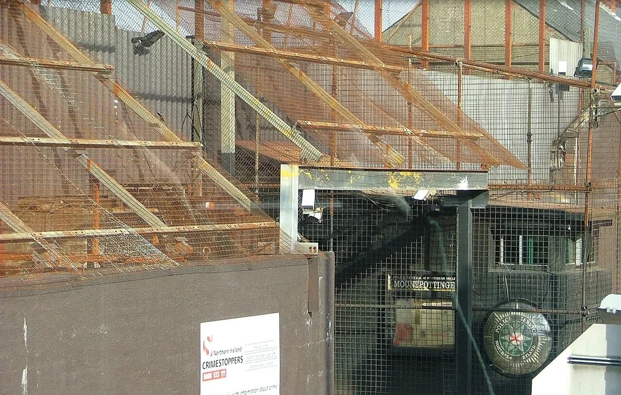 Wire mesh and paint marks on a police station in Belfast