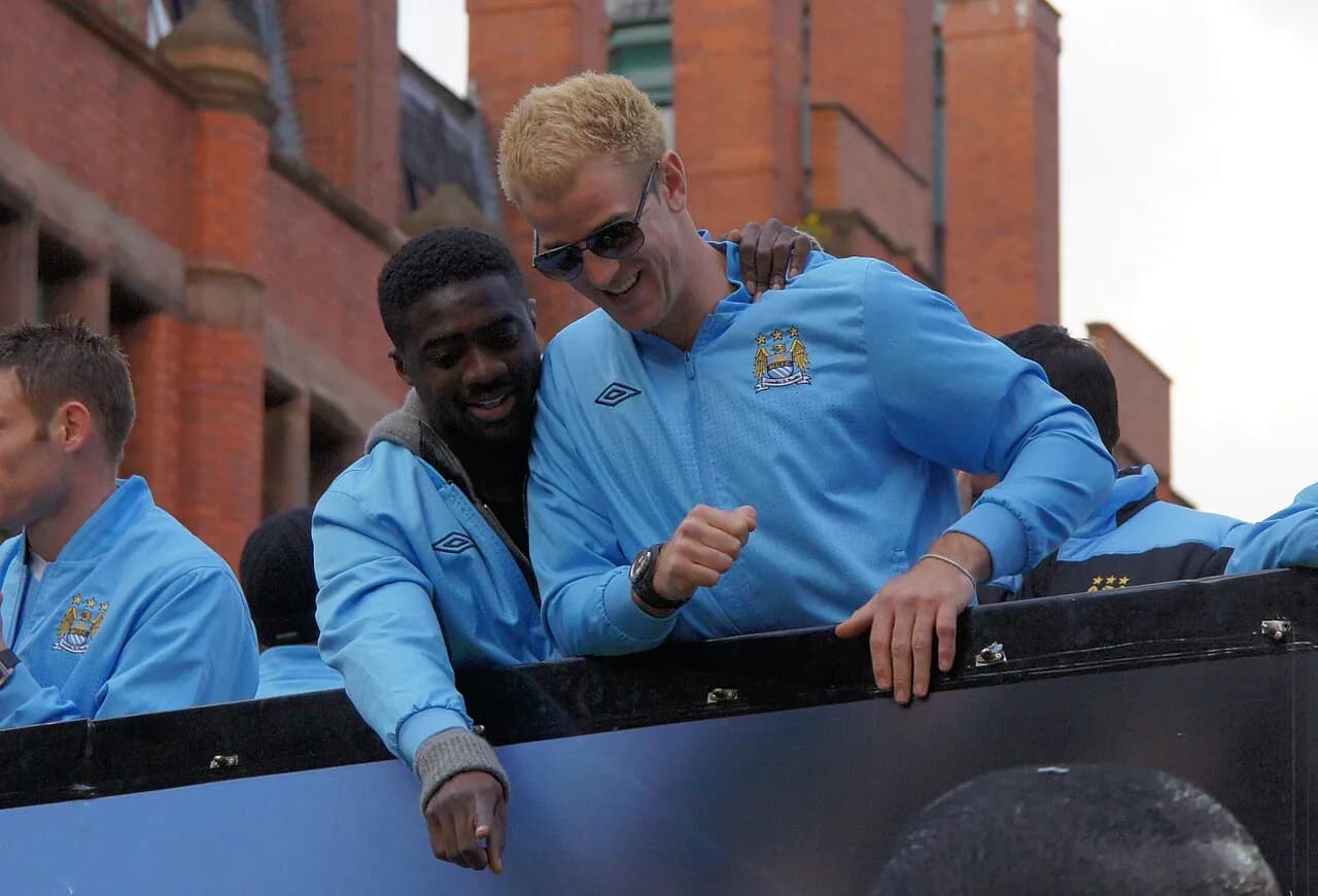 Joe Hart and Kolo Touré at a Manchester City victory parade in 2012