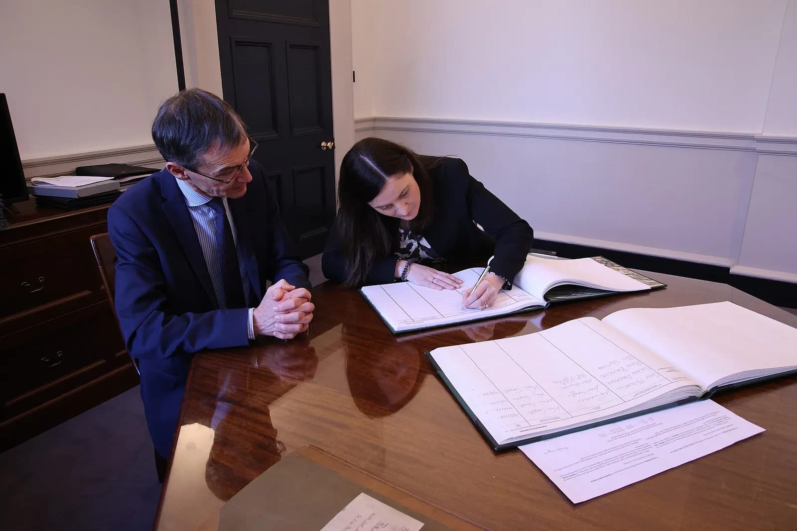 Catherine Ardagh signs the 34th Dáil Éireann Roll Book at Leinster House.