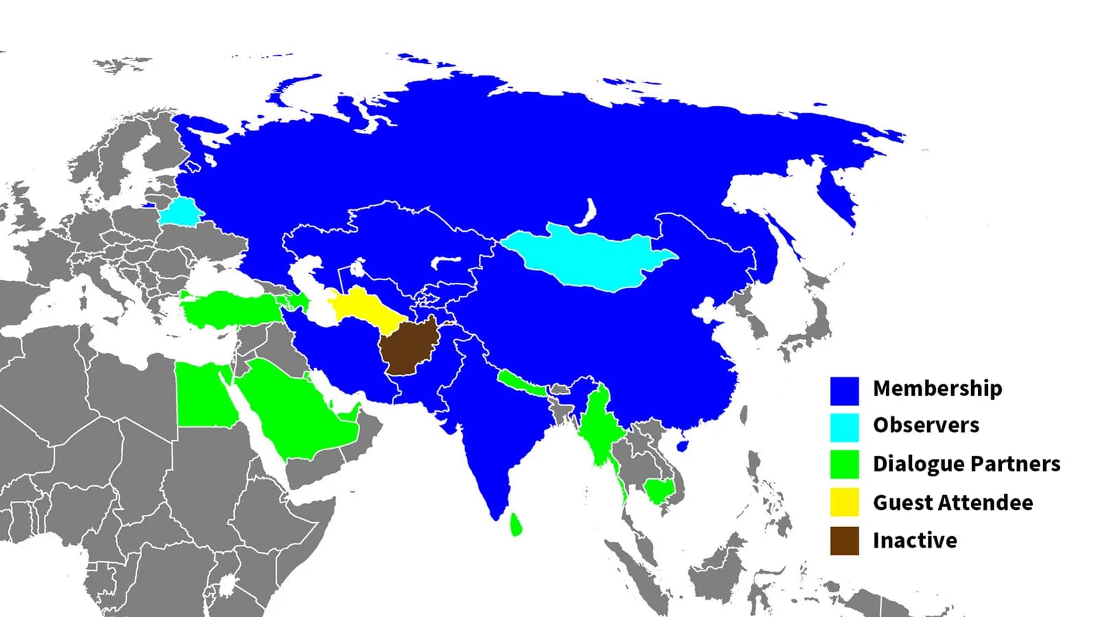 World map of Asia and Europe with countries coloured by their SCO status: blue for membership, cyan for observers, green for dialogue partners, yellow for guest attendee and brown for inactive, with a legend at the right.