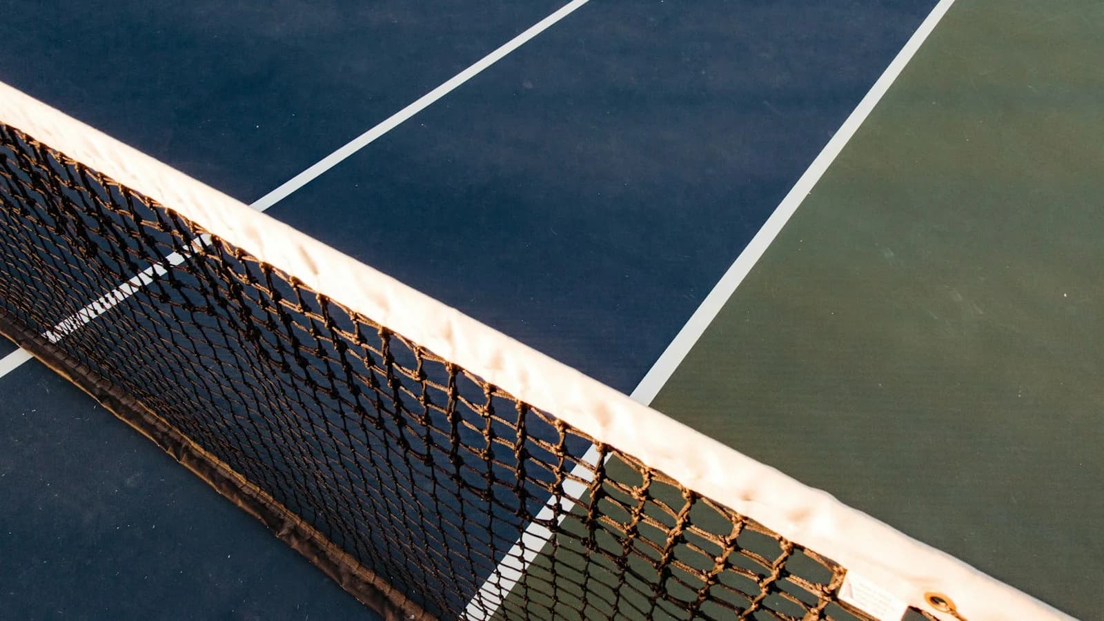 An empty tennis court at sunset