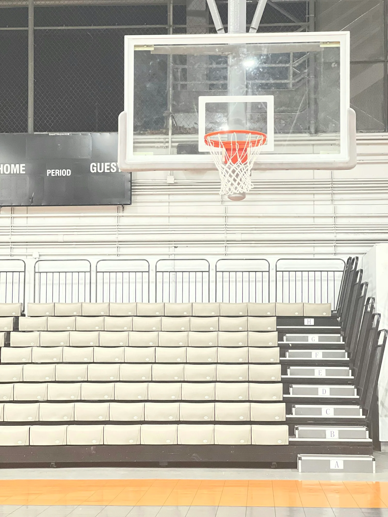 An indoor basketball court and empty bleachers in Puerto Rico