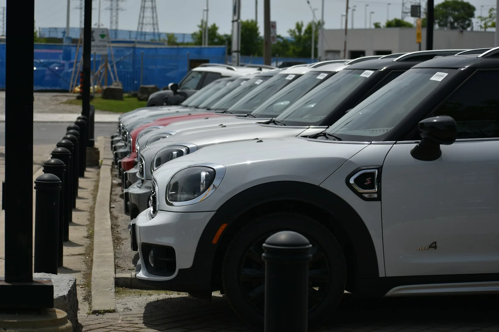 Cars parked in a row at a dealership